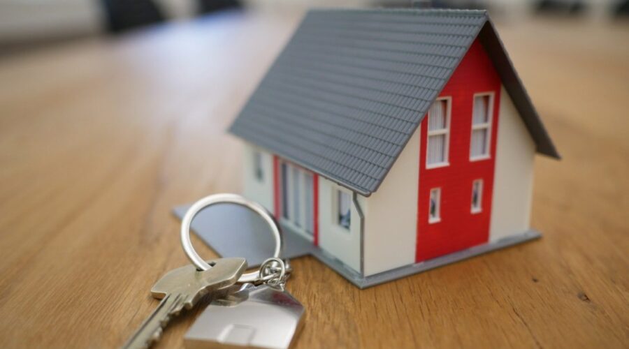 Model house and keys for Massachusetts property ownership